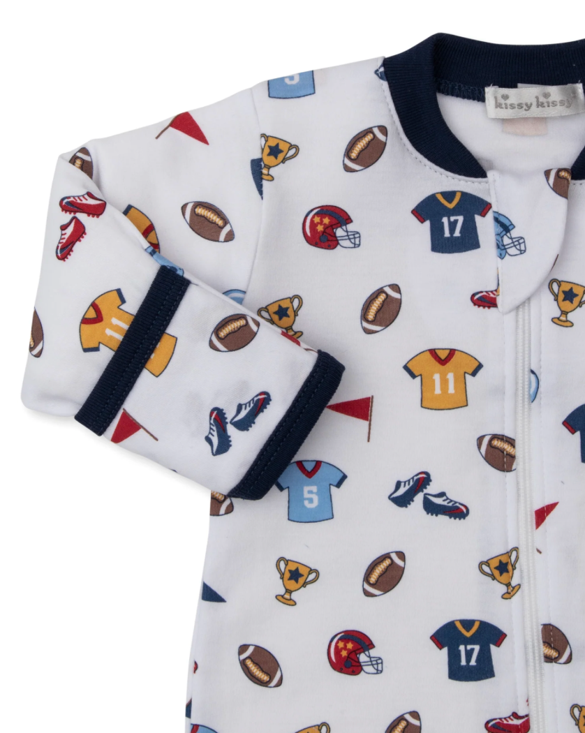 Baby outfit with sports-themed print on a white background