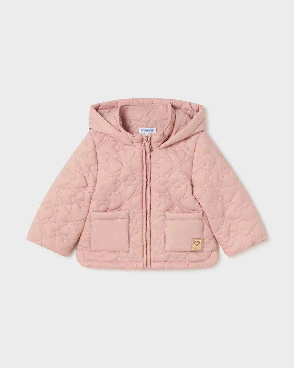 A pink baby quilted heart jacket with a hood, featuring heart imprints, and a visible brand tag.