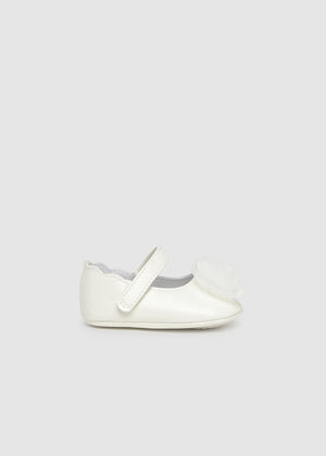 White shoe on a light gray background