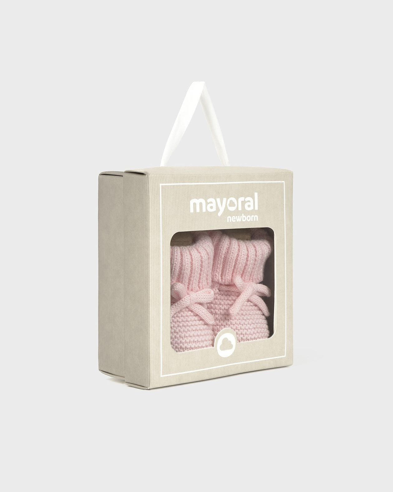 Pink baby booties in a Mayoral box on a light gray background